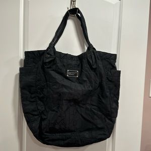 Marc Jacob’s bag can be used for diaper bag or work bag two pockets on the side